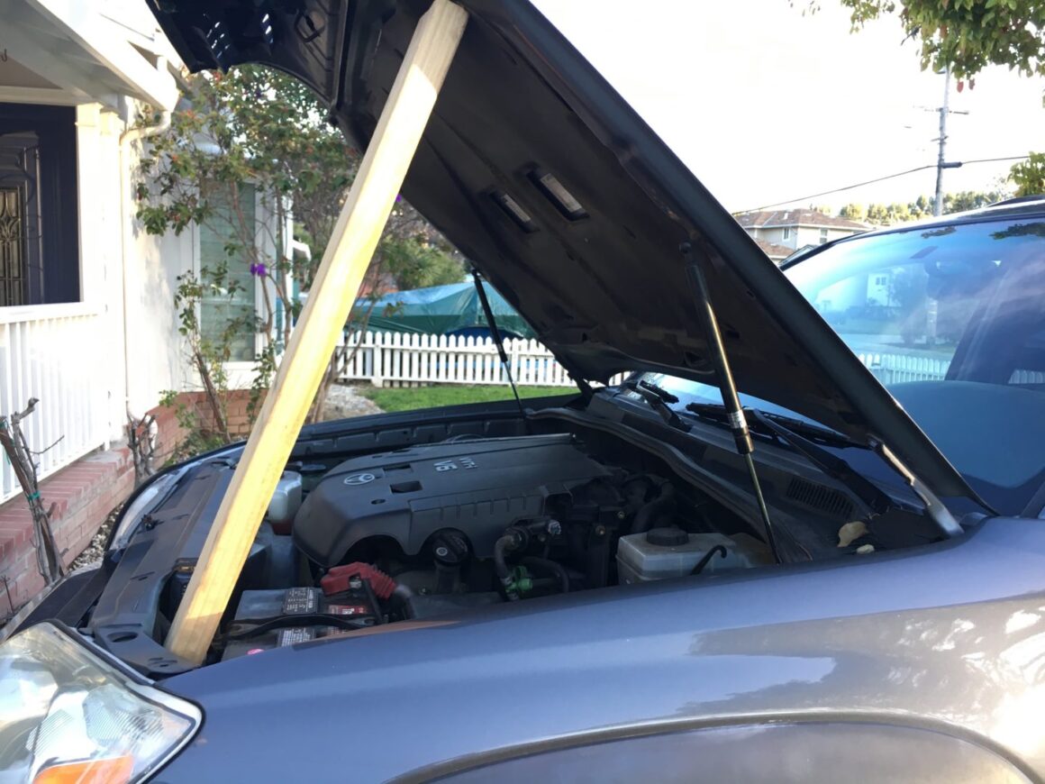 how to replace hood struts on toyota 4runner - holding hood open with wood