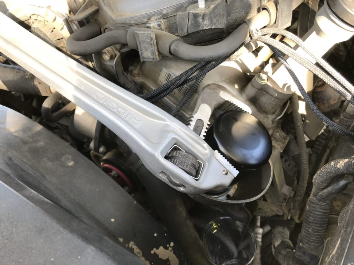 removing oil filter with pipe wrench