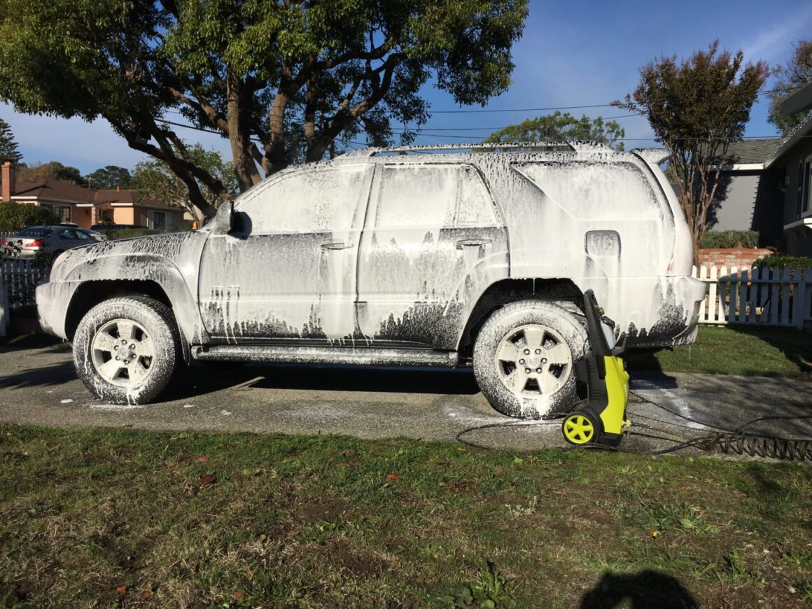 sunjoe pressure washer with snow foam applied to toyota 4runner