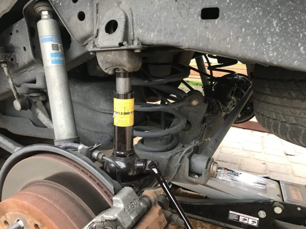 using a jack to remove rear springs