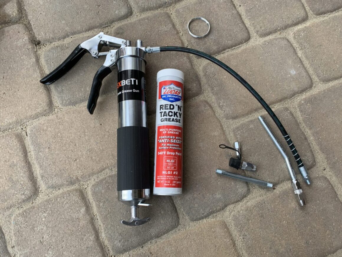 grease gun with red n tacky grease