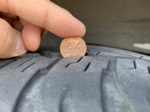 How to Check Tire Tread Depth with a Penny - The Track Ahead